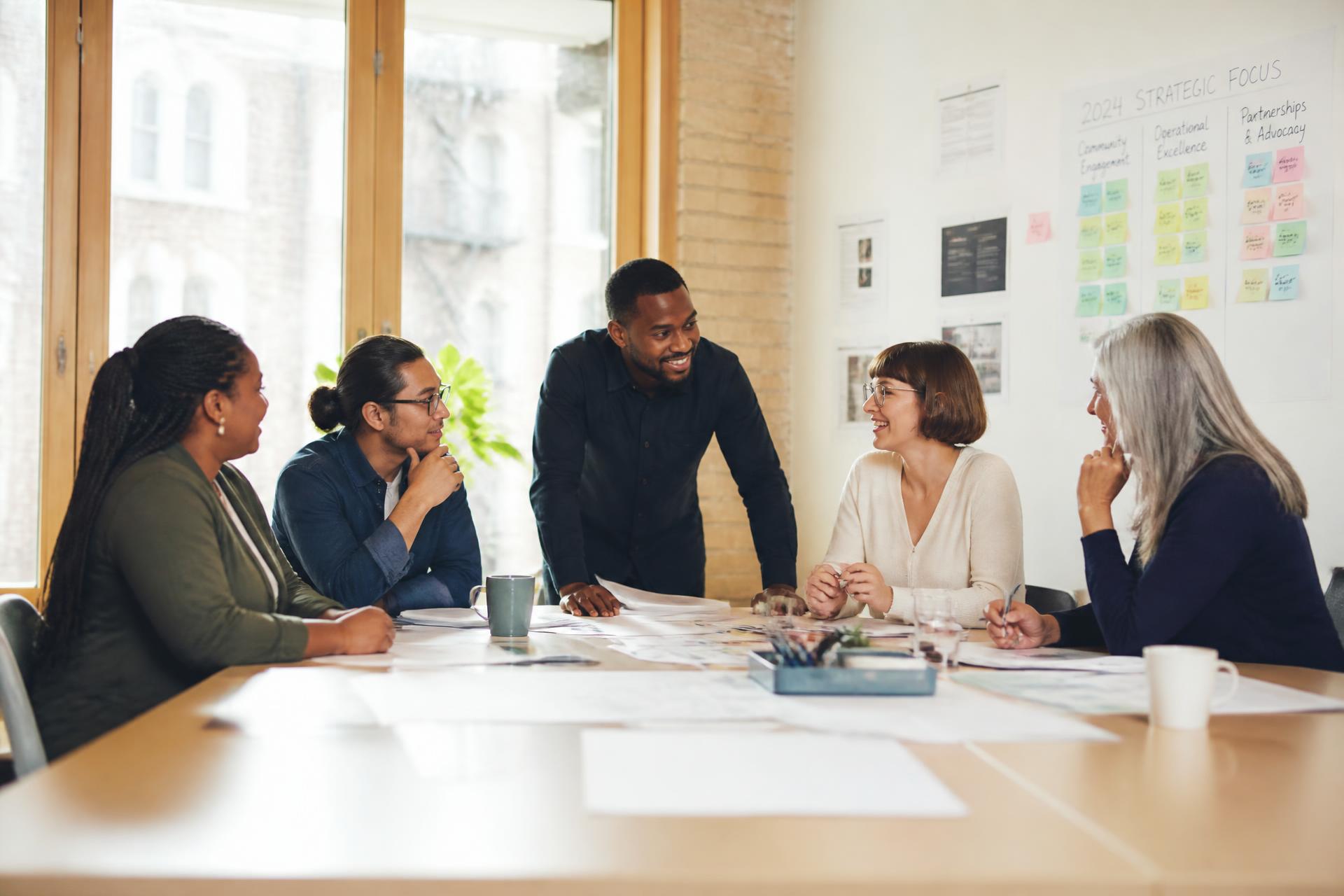 Nonprofit and public health leaders collaborating around a strategy session